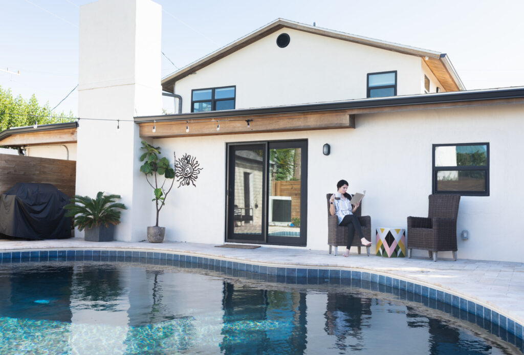 Backyard patio with sliding glass doors from Wallaby Windows, offering easy access, natural light, and a smooth transition between indoor and outdoor areas