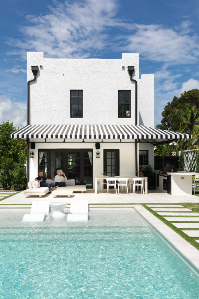 Modern home exterior with large energy-efficient windows and patio doors by Wallaby Windows, enhancing curb appeal and outdoor living space