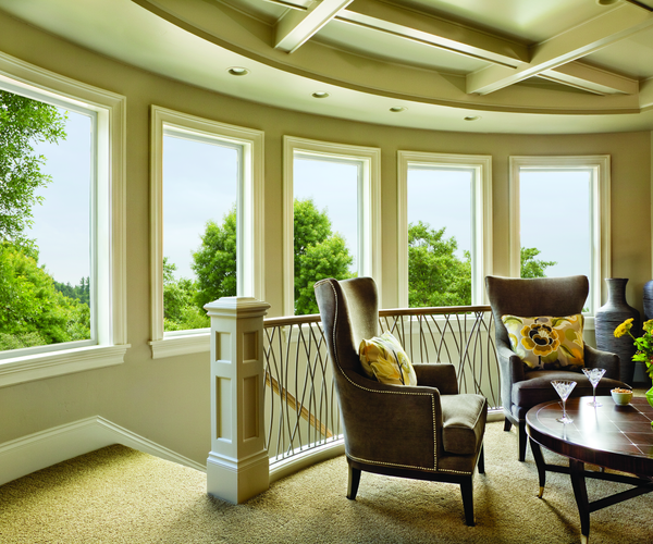 Custom multi-window installation creating panoramic views and natural light in a modern sitting area
