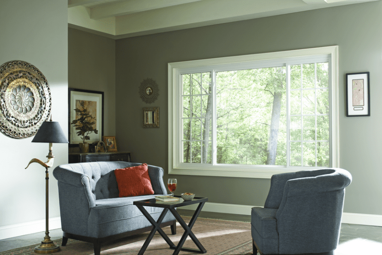 Energy-efficient living room window with large glass panes bringing in natural light and outdoor views