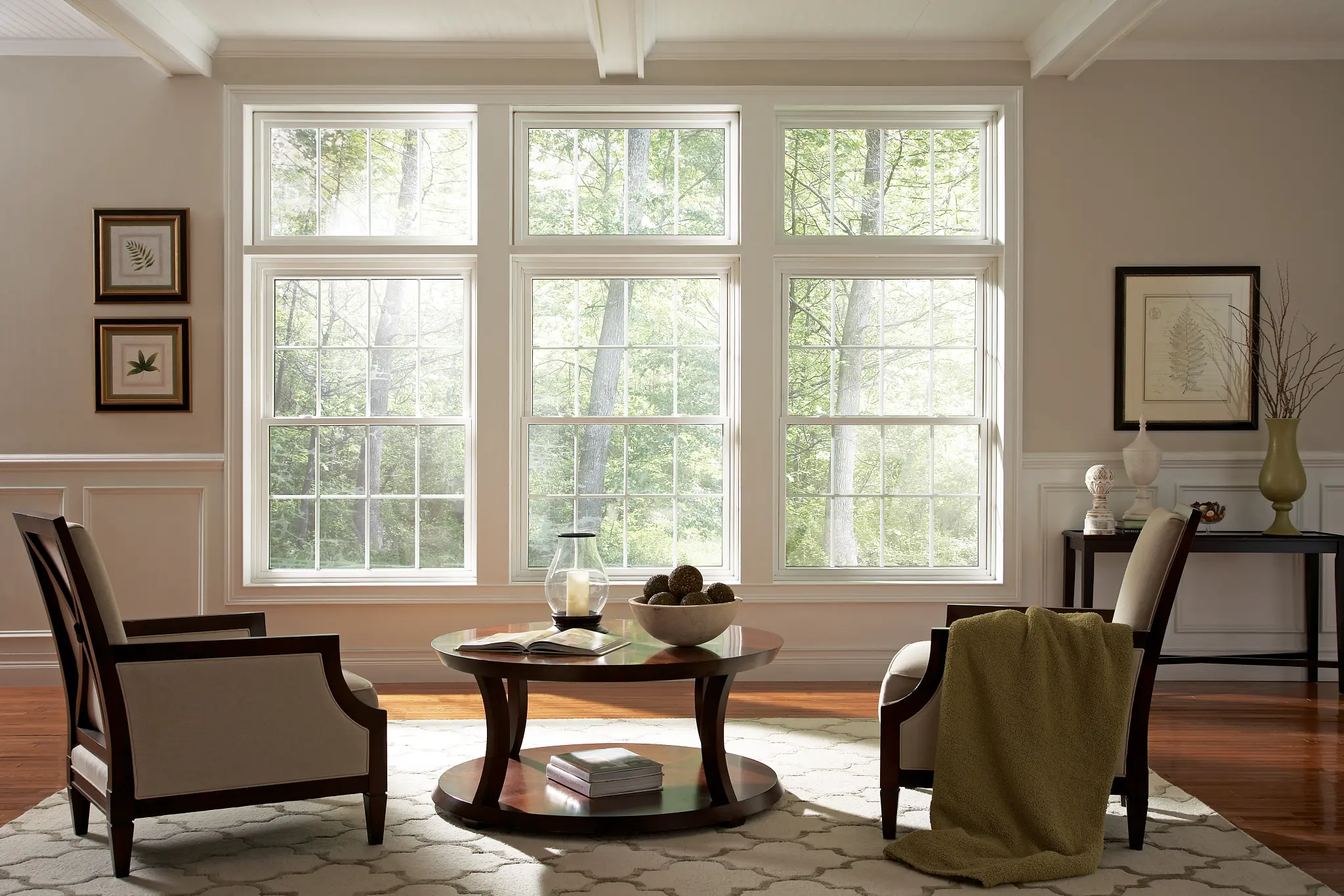 Bright living room with large double-hung replacement windows from Wallaby Windows, maximizing natural light and improving energy efficiency