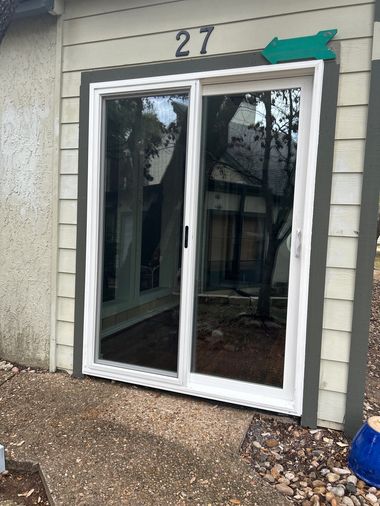 Newly installed sliding glass door with clean white frame and improved clarity, highlighting upgraded energy-efficient patio door installation (after)