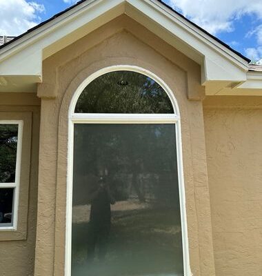 Professionally installed arched replacement window by Wallaby Windows enhancing energy efficiency and curb appeal