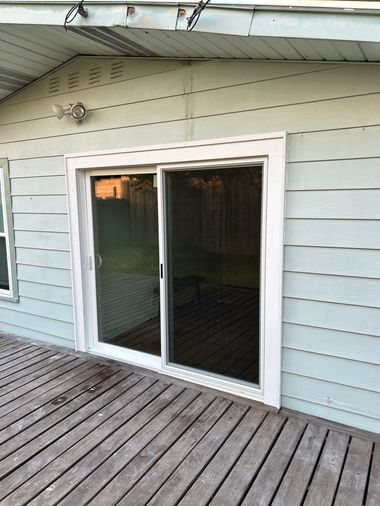 Wide-angle view of professionally installed sliding glass door from Wallaby Windows, showcasing seamless fit, smooth operation, and upgraded exterior appearance