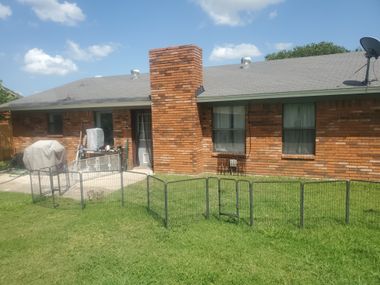 Original home exterior with outdated windows before professional replacement by Wallaby Windows
