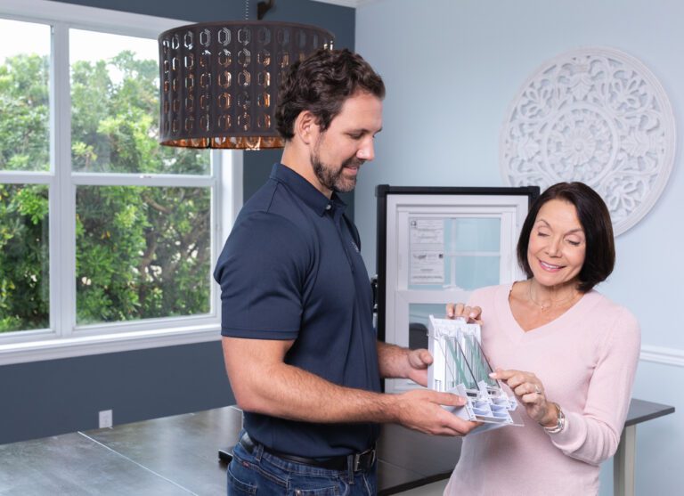 Wallaby Windows specialist providing a free in-home quote, reviewing window options and materials with a homeowner to ensure the best fit for comfort, style, and energy efficiency
