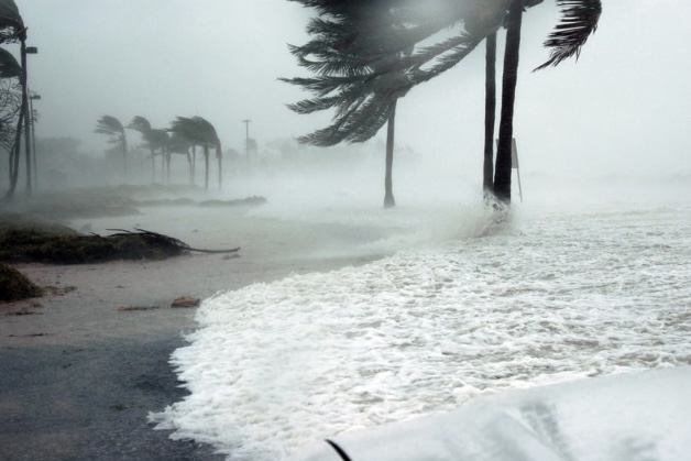 Severe coastal storm with strong winds and flooding highlighting the importance of hurricane-resistant windows for home protection