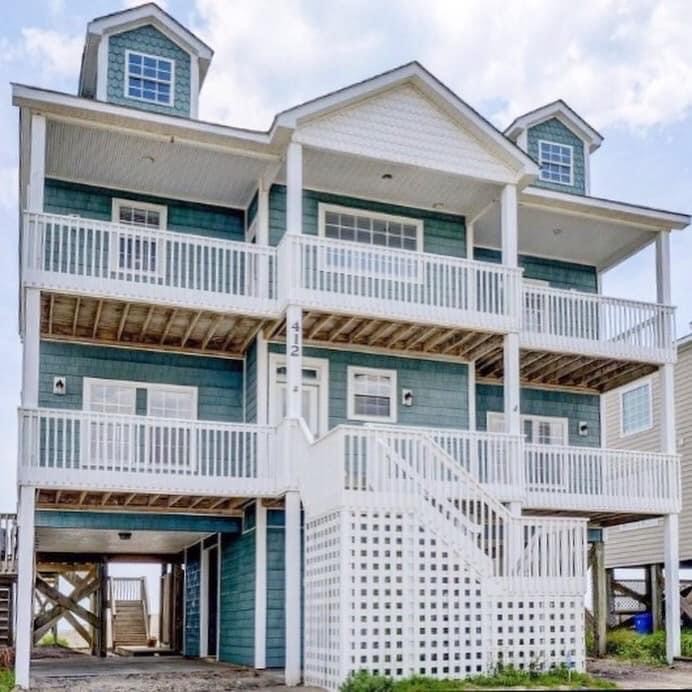 Coastal home with elevated design featuring durable, energy-efficient windows installed by Wallaby Windows for storm protection and long-term performance