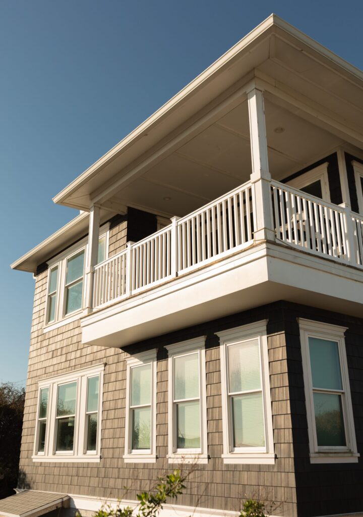 Two-story home with multiple replacement windows installed by Wallaby Windows in Raleigh NC