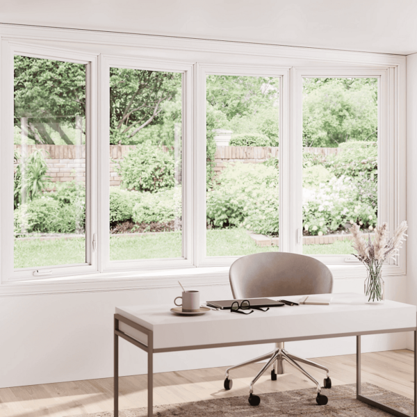 Modern home office with large bow window overlooking backyard