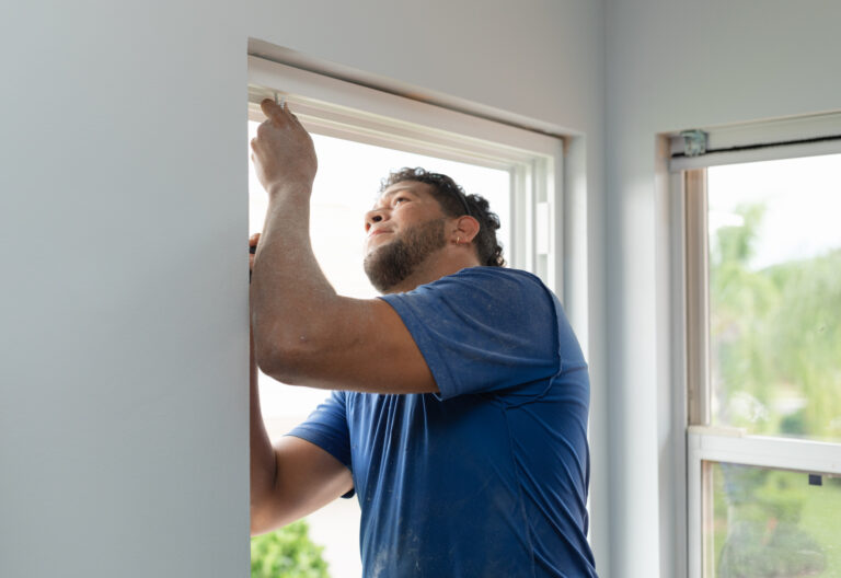 Wallaby Windows installer performing a White Glove window installation service in a Triangle Area home
