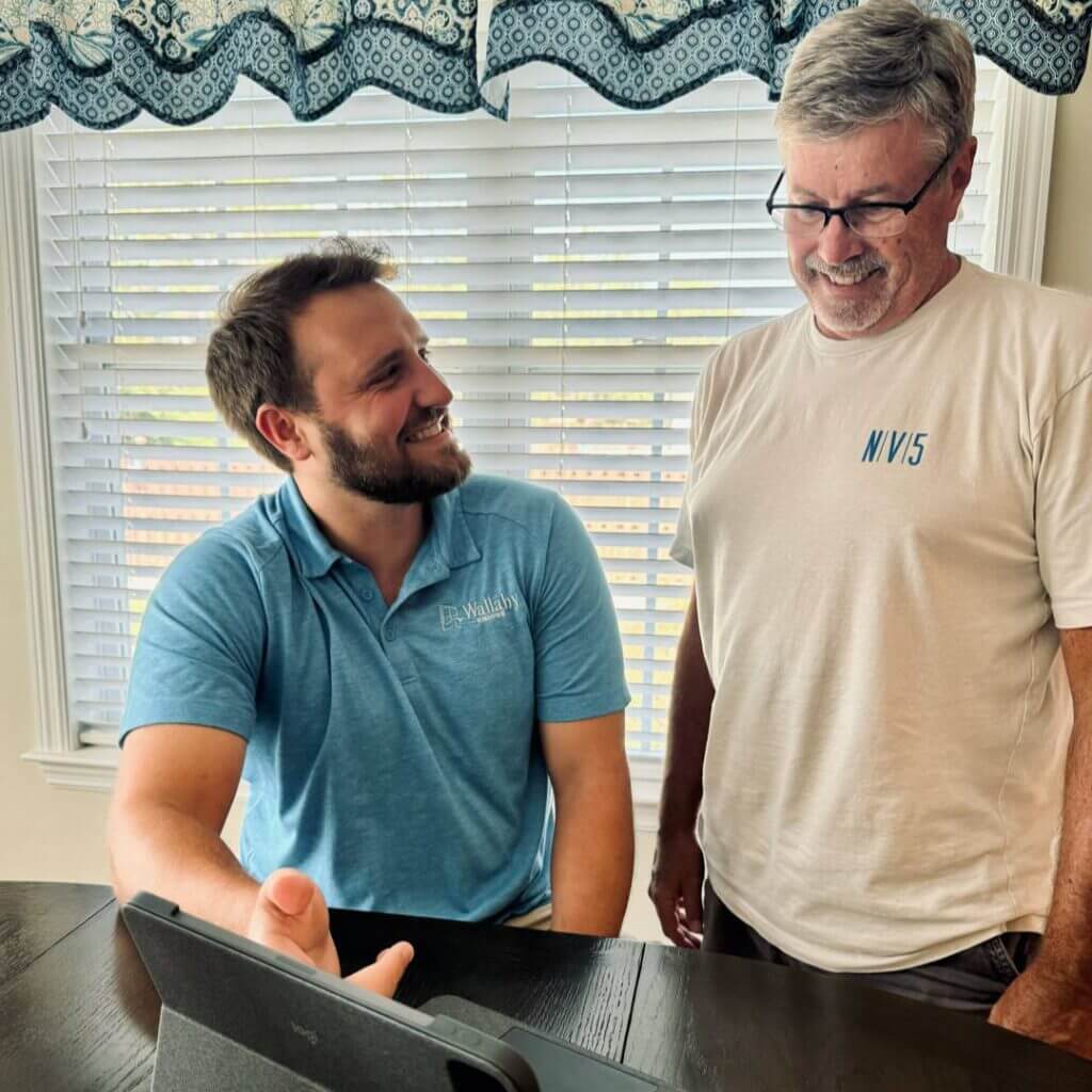 Wallaby Windows consultant reviewing project details with a homeowner